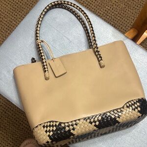 Elegant Etienne Aigner Beige and Black Leather Bag with crossbody strap.